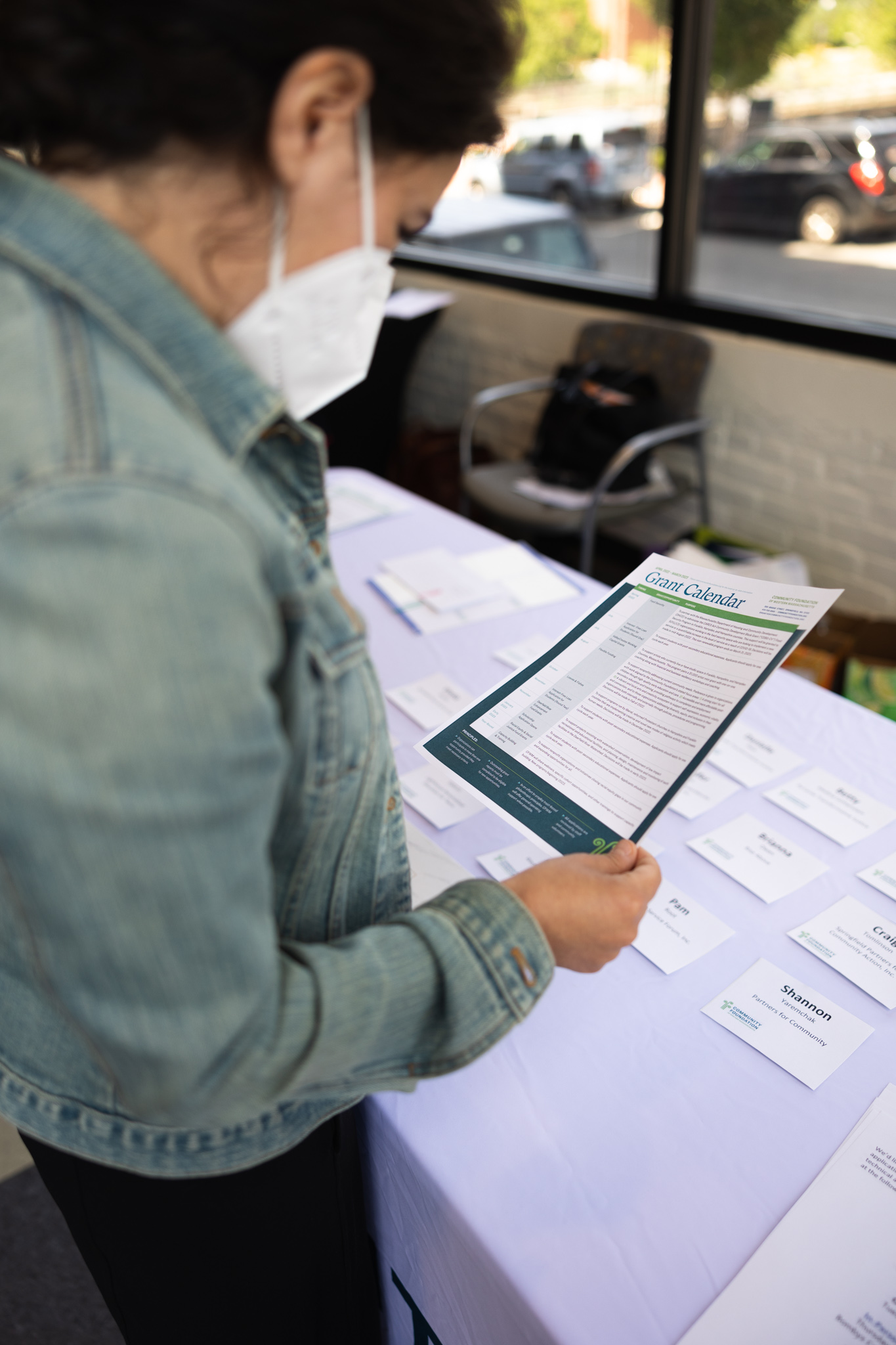 A prospective applicant reviews the grant calendar during an information session.